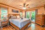 Main Level Master Suite Features King Bed, Flat Screen Tv, Private Bath, and Access to Covered Deck